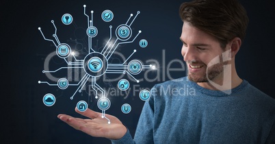 Businessman with hands palm open and various business icons interface