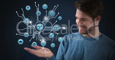 Businessman with hands palm open and various business icons interface