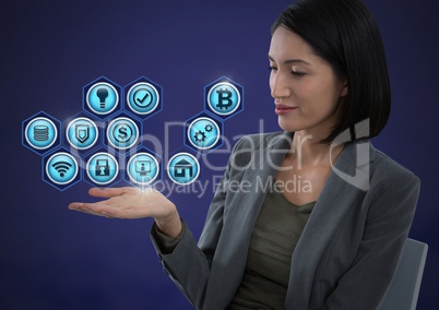 Businesswoman with hands palm open and various business icons