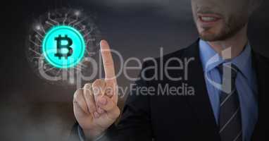 Businessman touching bitcoin graphic icon