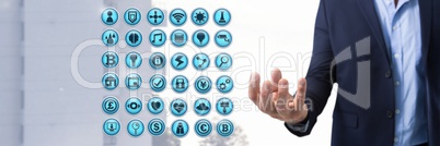 Various app icons and Businessman with hand palm open in city