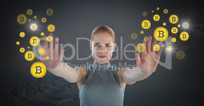 Futuristic Businesswoman touching bitcoin graphic icons