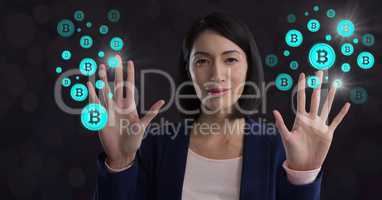 Businesswoman touching bitcoin graphic icons