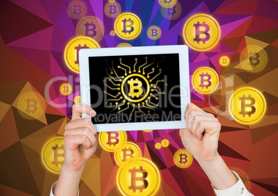 Bitcoin icons and hands holding tablet Bitcoin icons and hands holding tablet