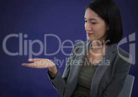 Businesswoman with hands palm open and dark background