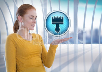 Clean brush icon and Businesswoman with hands palm open in city office