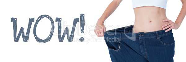Wow text and fit woman wearing oversized trousers