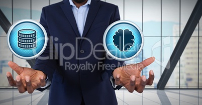 Money  and brain icons and Businessman with hands palm open in city office