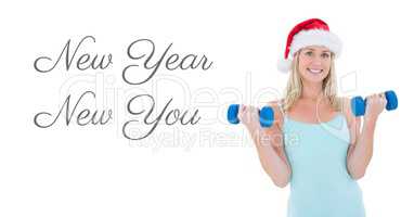 New Year New You text and fit woman lifting weights in Santa hat