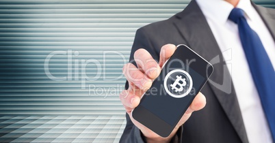 Bitcoin icon and hand holding phone