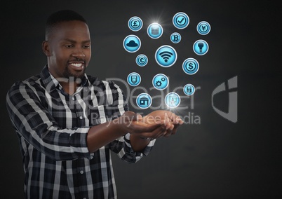 Businessman with hands palm open and various business icons