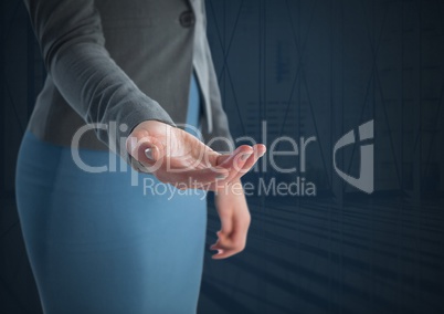 Businesswoman with hand palm open and dark background