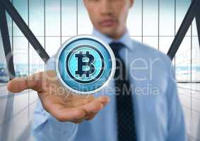 Bitcoin icon and Businessman with hand palm open in city office