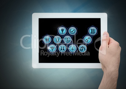 hand holding tablet and business icons
