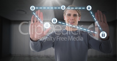 Businessman holding hands up to security lock icons connecting on map