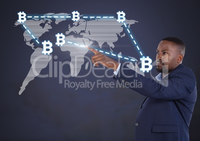 Businessman pointing with bitcoin graphic icons on world map