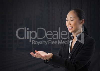 Businesswoman with hands palm open and dark background Businesswoman with hands palm open and dark background