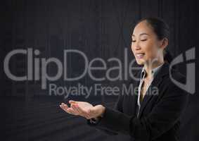 Businesswoman with hands palm open and dark background