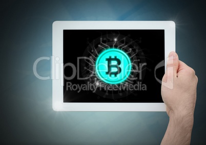 Bitcoin icon and hand holding tablet