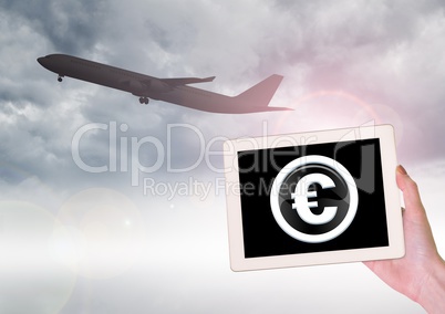 Airplane and euro icon on tablet in hand