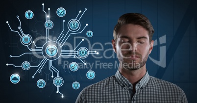 Businessman with eyes closed and various business icons interface