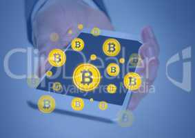 Bitcoin icons and hand holding phone