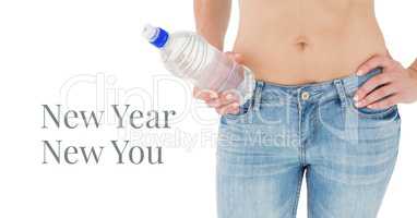 New year new you text and fit woman's waist holding bottle of water