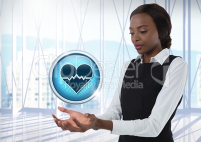 Heart pulse icon and Businesswoman with hands palm open in city office