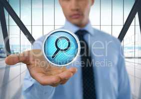 Magnifying glass search icon and Businessman with hand palm open in city office
