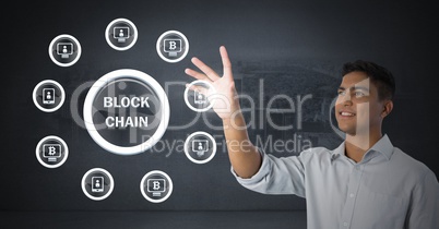 Businessman touching blockchain graphics