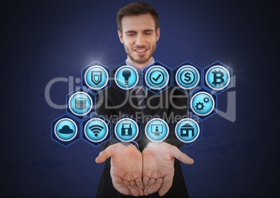 Businessman with hands palm open and various business icons