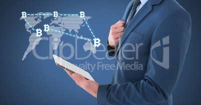 Bitcoin network on world map with businessman holding tablet