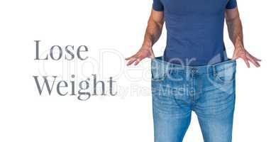 Lose weight text and man with oversized jeans