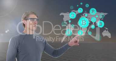 Businessman touching bitcoin graphic icon world map