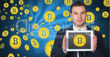 Bitcoin icons and man holding tablet