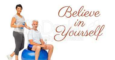 Believe in yourself text and fit old couple with exercise ball