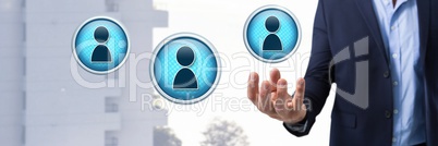 Profile contact icons and Businessman with hand palm open in city