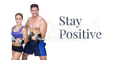 Stay positive text and fitness couple lifting weights