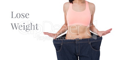 Lose weight text and fit woman wearing oversized trousers