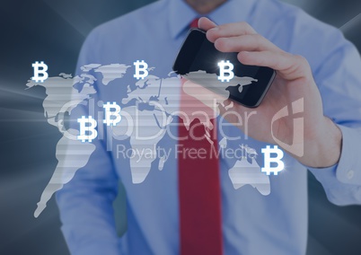 Bitcoin icons on world map and man holding phone