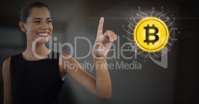 Businesswoman touching bitcoin graphic icon Businesswoman touching bitcoin graphic icon