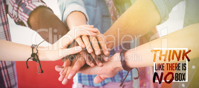 Composite image of fashion students putting hands together