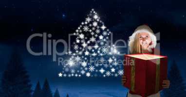 Woman Santa holding magical gift and Snowflake Christmas tree pattern shape glowing in Winter night