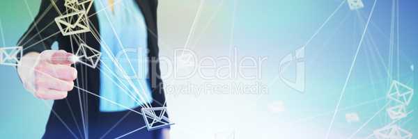 Composite image of mid section of businesswoman touching imaginary interface