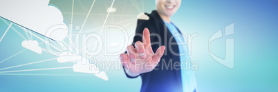 Composite image of mid section of smiling businesswoman touching imaginary interface