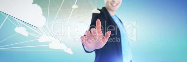 Composite image of mid section of smiling businesswoman touching imaginary interface
