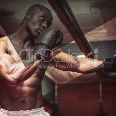 Young Bodybuilder boxing a bag