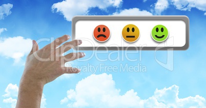 Hand touching smiley faces feedback buttons