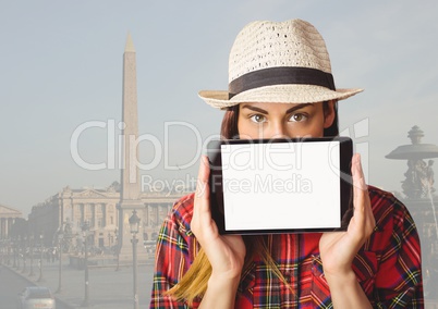Girl holding tablet in travel destination