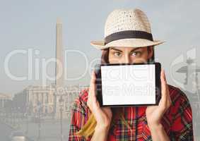 Girl holding tablet in travel destination